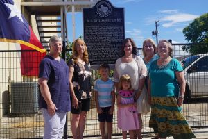 Relatives of the Williams family: (L/R) Susie Gillett Addisson and Cathy Gillett Hunter who are descendants of W. C. Williams’ sister, Mattie Williams Gillett. On the far right is Mrs. Pat Williams whose late husband Charles was a descendant of W. C. Williams. In front of the marker is Jackson Coulter, Grandson of Melinda Williams. Charlotte Coulter is standing in front of her Grandmother, Melinda Williams and Susan Parrish is to the right of Melinda. Melinda and Susan are the Children of Pat and Charles Williams.